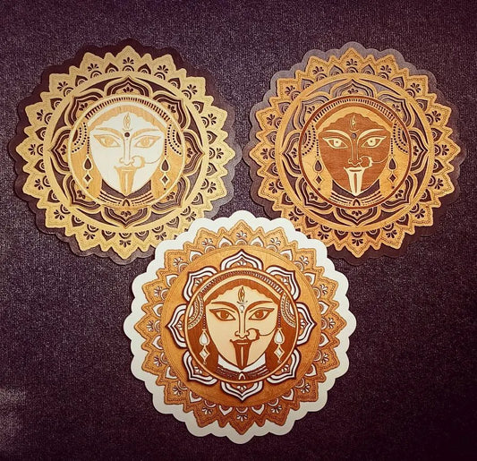 Three decorative circular designs with face-like central figures on a dark background